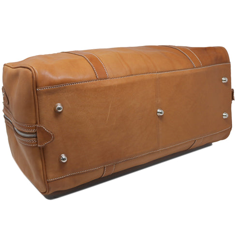 The Floto Parma Duffle Bag is a leather weekender that is handcrafted in Italy with our famous Parma leather. Parma leather is tanned in a special way with no chemicals so the bag will get better as it ages - each travel bag takes on a unique look and darkens like a saddle over time. Parma is leather tanning the natural way. 5